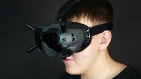 Close Up of Young Man Touching Buttons on VR Headset, Virtual Reality and Gaming Concept