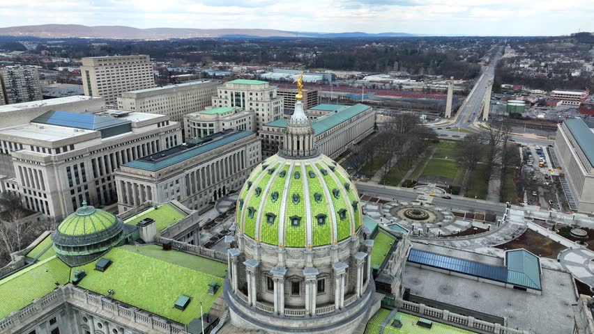Harrisburg capitol building in Pennsylvania. United States government offices in background. Aerial drone orbit shot.