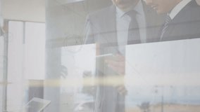 Animation of connections over caucasian businessmen working in office. Business, connections, cooperation and technology concept digitally generated video. - Powered by Shutterstock - Get 15% off with code: PIKWIZARD15