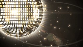 Animation of glowing disco ball over dark background. Global music and entertainment concept digital generated video.