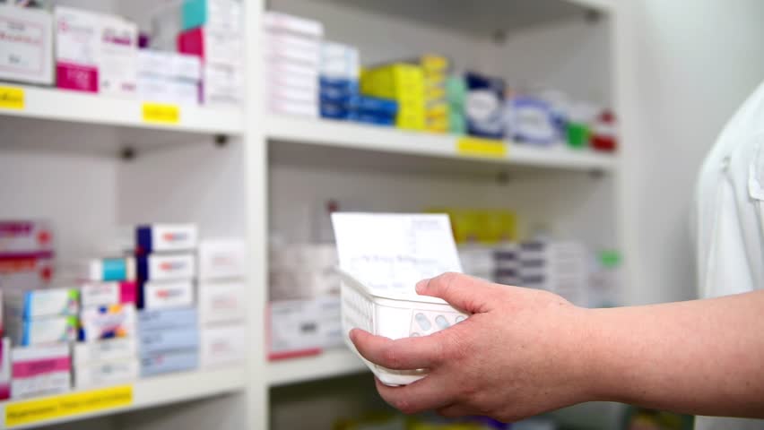 Pharmacist filling prescription in pharmacy drugstore	 | Shutterstock HD Video #1100900713
