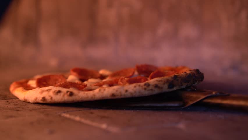 wood fire pepperoni pizza cinematic Royalty-Free Stock Footage #1100902725