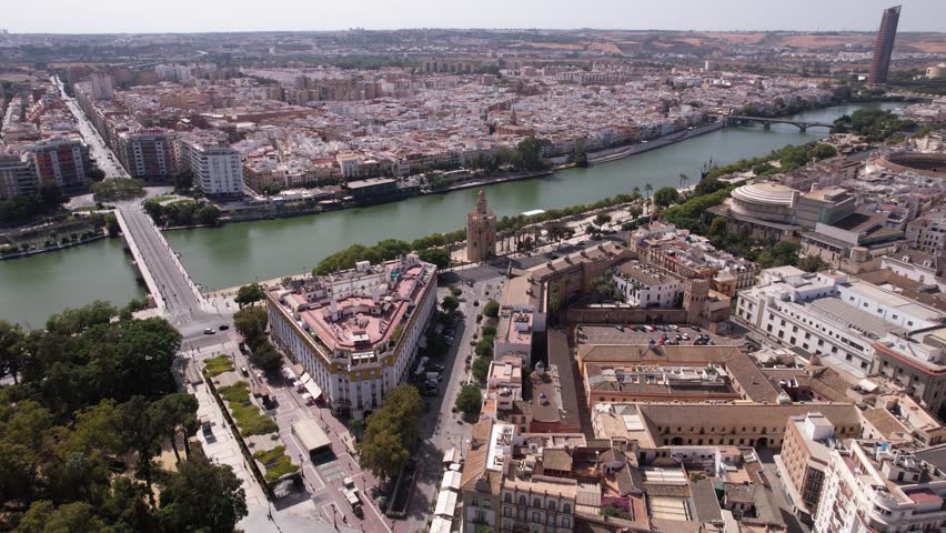 Seville Spain. Aerial View of Torre Del Oro River Canal and Traffic on Sunny Day