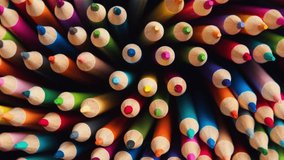 Top view of sharpened multicolored drawing pencils, rotating in a circle. Pile of colored pencils slow rotation close-up. Sharpened multi-colored pencils for drawing in a circle motion.d  - Powered by Shutterstock - Get 15% off with code: PIKWIZARD15