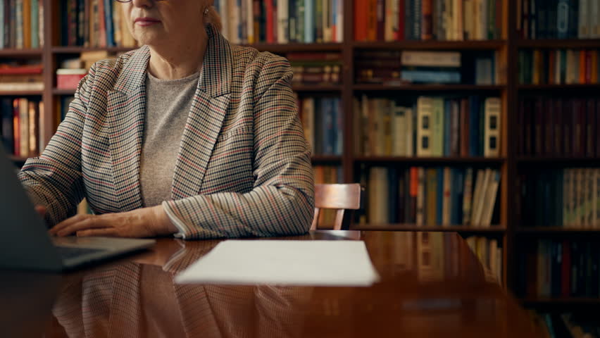 Closeup of schoolchildren bringing school assignments to teacher, education