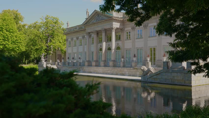 Summer day view of the Palace on the Isle (Polish: Pałac Na Wyspie), also known as Baths Palace (Polish: Pałac Łazienkowski) Łazienki Park or Royal Baths Park. Landmark of Poland.