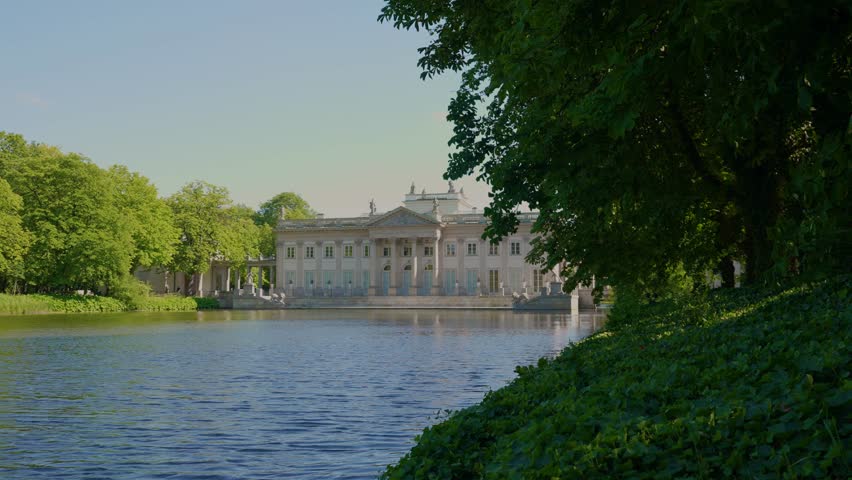 Summer day view of the Palace on the Isle (Polish: Pałac Na Wyspie), also known as Baths Palace (Polish: Pałac Łazienkowski) Łazienki Park or Royal Baths Park. Landmark of Poland.