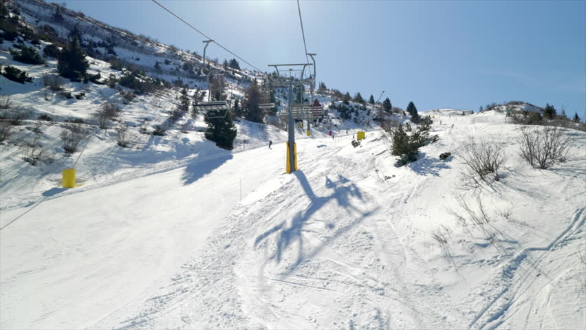 Skiing and snowboarding in the Italian Alps. Beautiful winter view from gondola on the Monte Bondone mountain of Trentino, northern Italy.