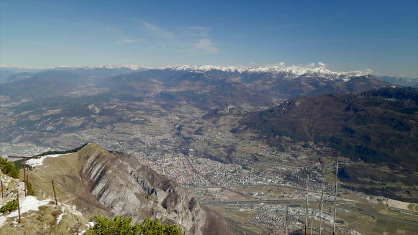 Skiing and snowboarding in the Italian Alps. Beautiful winter view on the city of Trento and the Adige valley from the Monte Bondone mountain, northern Italy