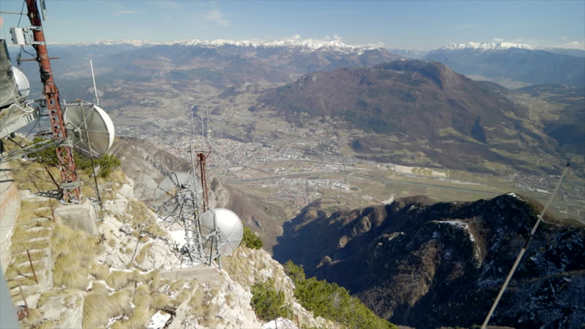Skiing and snowboarding in the Italian Alps. Beautiful winter view on the city of Trento and the Adige valley from the Monte Bondone mountain, northern Italy
