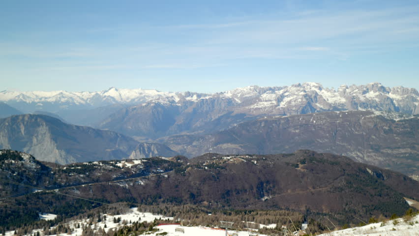 Skiing and snowboarding in the Italian Alps. Beautiful winter view on the Brenta group from the Monte Bondone mountain of Trentino, northern Italy