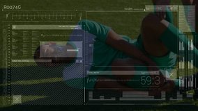 Interface with data processing against injured african american male soccer player holding his leg. sports and technology concept - Powered by Shutterstock - Get 15% off with code: PIKWIZARD15