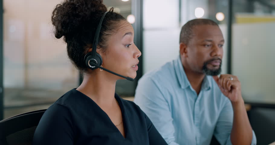 Call center, training and communication with boss in office for expert guidance, help and advice. Black people talking at online customer service consulting company for professional work feedback. | Shutterstock HD Video #1100928487