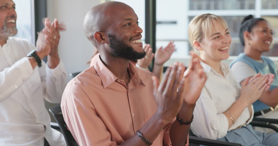 Applause, crowd and seminar with a business team clapping during a convention or training in the workplace. Conference, presentation and speech with a man and woman employee audience applauding