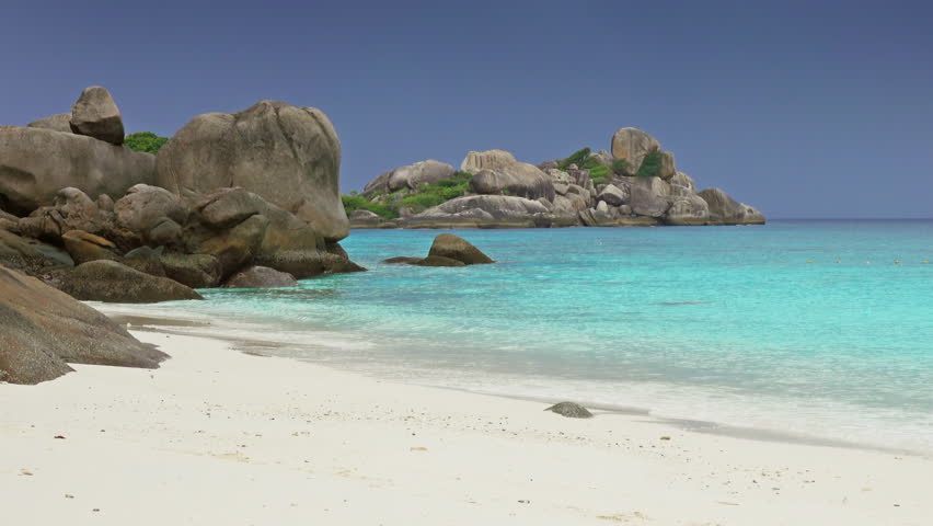 Landscape with white sand beach and storm sky on Similan islands, Thailand