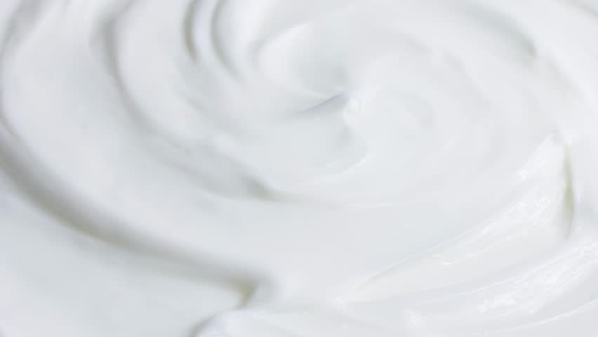 White smooth creamy moisturizing face cream texture rotation close up Royalty-Free Stock Footage #1100933031