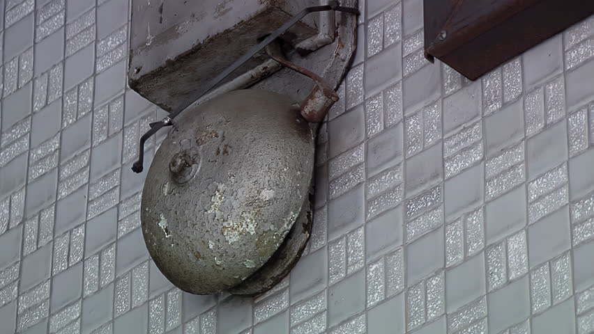 Vintage School Bell in School Corridor. Close Up. 4K Resolution.