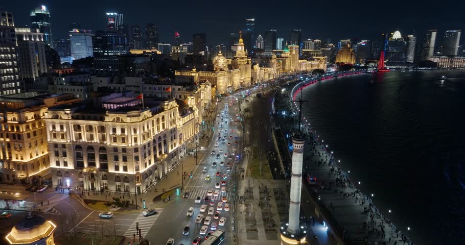 Aerial view of The bund in Shanghai at night.Exotic building clusters in the Bund of Shanghai，Tourists enjoy the view of the city from the sightseeing platform.