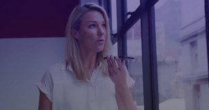 Animation of financial data processing over caucasian businesswoman using smartphone. Global business, finances, computing and data processing concept digitally generated video.