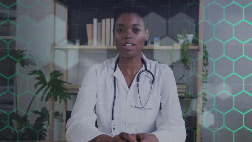 Animation of network of hexagons over african american female doctor. Global medicine, computing and data processing concept digitally generated video.