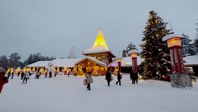 Santa Claus Village Shooting at Santa Claus near Rovaniemi in Lapland - Finland. Ice hotel with ice bar and restaurant services. carved ice walls. drone videos. Night at Santa Claus. Lights and snow.  - Powered by Shutterstock - Get 15% off with code: PIKWIZARD15