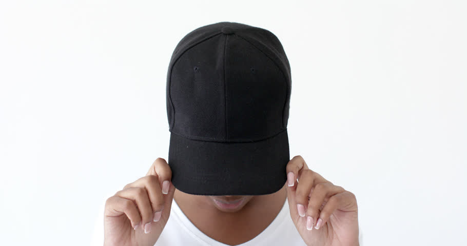African american woman wearing black peaked cap with copy space on white background. Clothes, fashion and design concept.