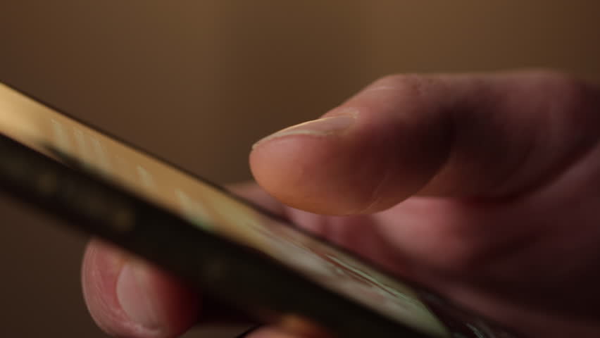 Side view of a man's hand scrolling. Doom scrolling concept Royalty-Free Stock Footage #1100954451