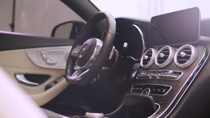 Clean and luxurious interior of a brand new car, featuring modern amenities and advanced features. Royalty-Free Stock Footage #1100954579