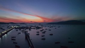aerial view Chalong gulf in colorful of twilight. 
first light above archipelago in chalong gulf Phuket thailand.
4k stock footage video in travel concept.
