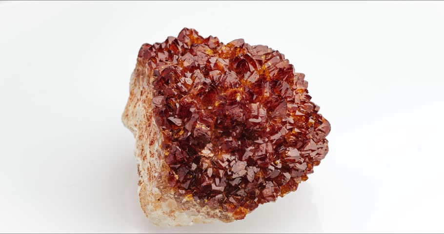 Citrine geode crystal seamless rotating on white background. macro detail texture background. close-up raw rough unpolished semi-precious gemstone