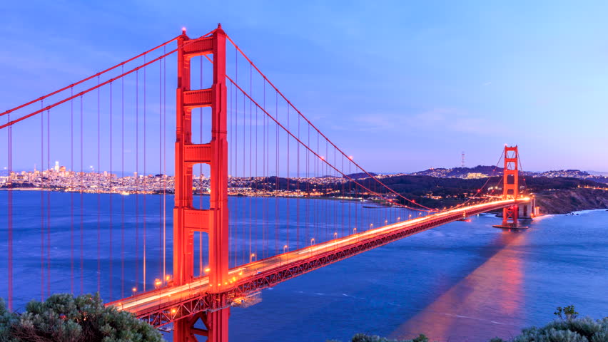 Time Lapse: Ship sails under Golden Gate Bridge to San Francisco at sunset