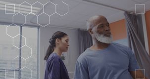 Animation of dna strand over biracial female doctor with male patient. Global medicine, healthcare, digital interface, computing and data processing concept digitally generated video.