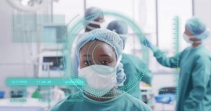 Animation of medical data processing over african american female surgeon. Global medicine, healthcare, digital interface, computing and data processing concept digitally generated video.