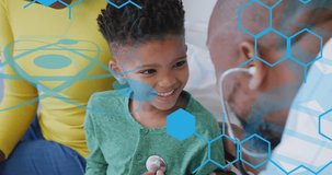 Animation of medical data over african american male doctor and boy patient. Global medicine, healthcare, digital interface, computing and data processing concept digitally generated video.