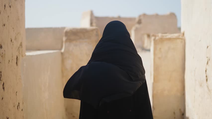 muslim woman walking at streets of abandoned village al jumail in Qatar
 Royalty-Free Stock Footage #1100967749