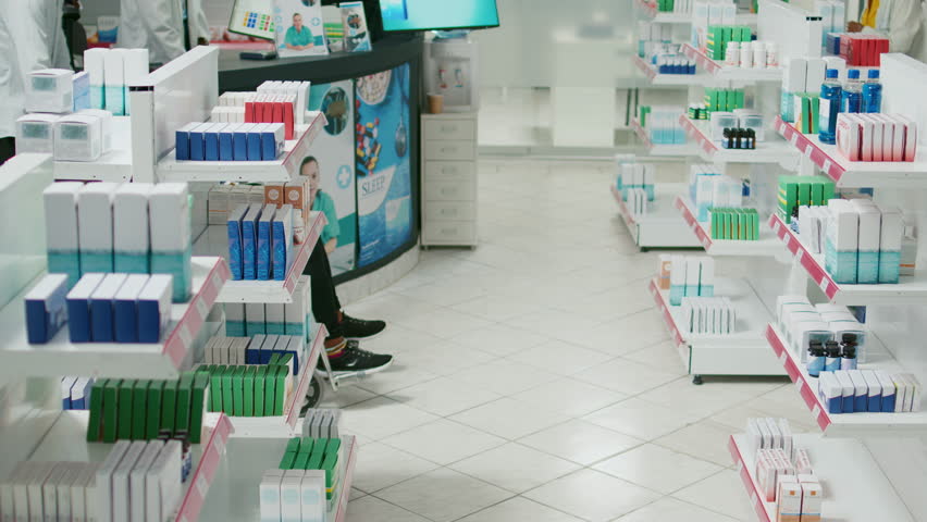 Client in wheelchair and social worker asking for pills, talking to specialist about healthcare medicine. Male employee recommending medicaments and vitamins to wheelchair user.