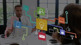 Animation of connected icons forming flowchart over diverse coworkers discussing reports in office. Digital composite, multiple exposure, ideas, social media, teamwork, communication and technology. - Powered by Shutterstock - Get 15% off with code: PIKWIZARD15