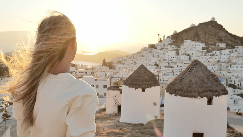 SLOW MOTION: Woman making a hearth shaped finger frame in Greece 