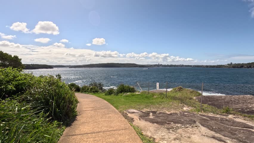 Beautiful scenary from walk track at Bronte Beach, Sydney. Sea view can be seen from distance. Beautiful blue sky in summer. Video shot in Feb 2023, Sydney, Australia.