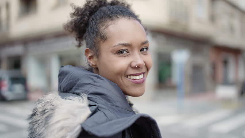 African american woman smiling confident standing at street