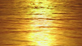 Golden water wave texture background. Footage stock background concept Water wave sunset refection animation background. High quality footage stock 4K ProRes422