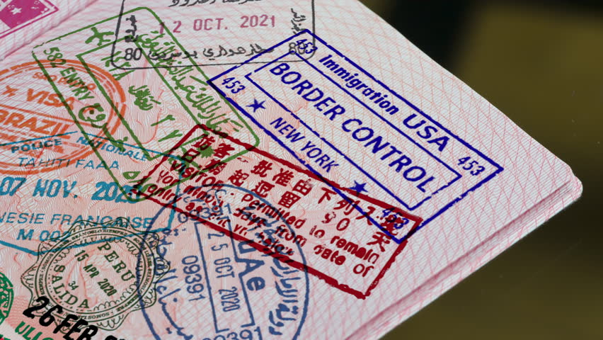 Active Travel all over the World. A stamp is placed on the page of the passport and leaves an ink impression of entry into the country. Stamps from different countries begin to appear on the page
