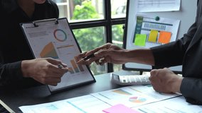 Financial analyst analysis business financial report on digital tablet during discussion at meeting of corporate showing the results of their successful teamwork., business meeting concept, Marketing	 - Powered by Shutterstock - Get 15% off with code: PIKWIZARD15