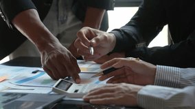 Financial analyst analysis business financial report on digital tablet during discussion at meeting of corporate showing the results of their successful teamwork., business meeting concept, Marketing	 - Powered by Shutterstock - Get 15% off with code: PIKWIZARD15