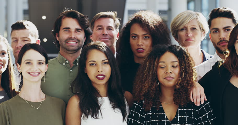 Group face portrait of happy formal corporate business people standing proud together in their workspace. A crowd of proud, professional and diverse employee team smiling looking at the camera | Shutterstock HD Video #1100991851