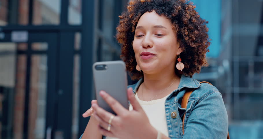 Woman, influencer on social media live streaming or video call, talking and hello in city, smartphone and brand promo. Female, travel or lifestyle blog, happy with content creation and communication | Shutterstock HD Video #1100992003