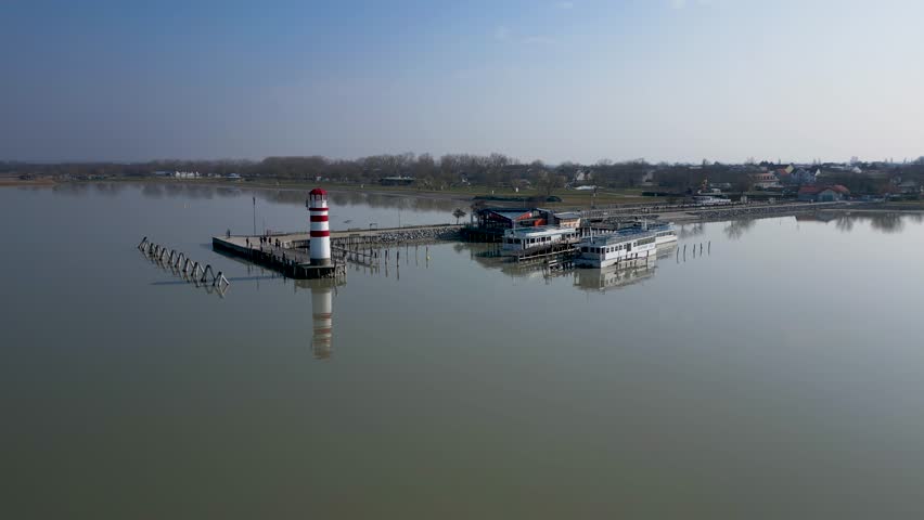 Stunning view of Neusiedler See, massive lake with a lighthouse, sunny day, 4k