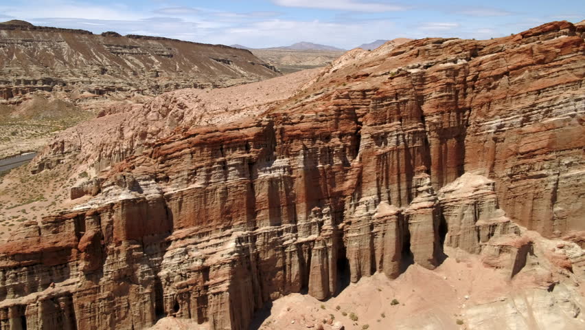 Aerial Backward Panning Beautiful View Of Natural Buttes In Red Rock Canyon State Park On Sunny Day - Cantil, California
