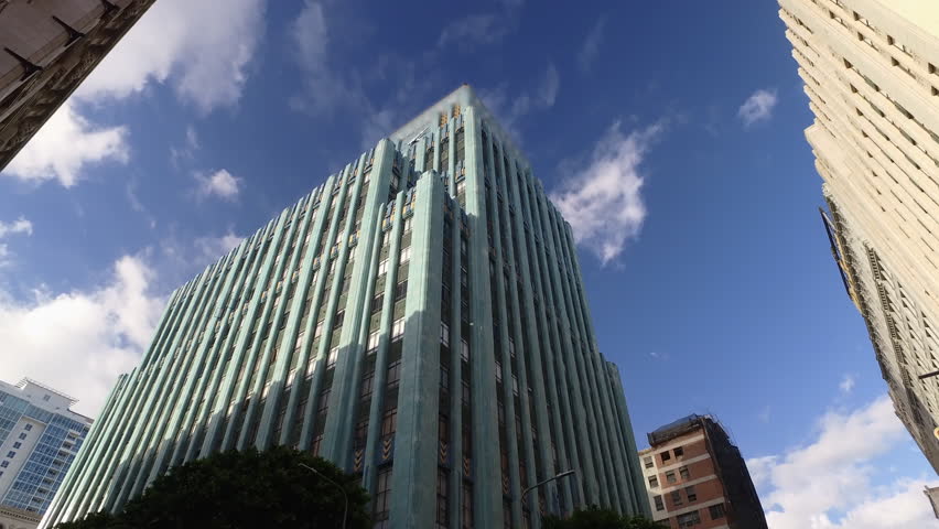 Aerial: Pov From A Car Driving Past The Eastern Columbia Lofts High-Rise Building In Downtown - Los Angeles, California
