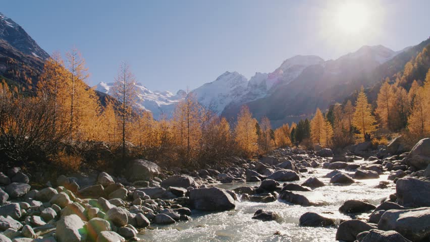 beatiful nature scenery in switzerland with glacier, mountains and river in autumn